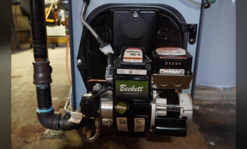 Beckett oil burner on a Weil-McLain oil boiler serviced by Unity Heating & Air Conditioning