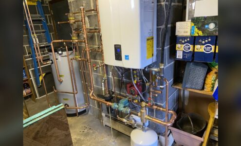 Gas combi boiler and copper manifold installed by Unity Heating & Air Conditioning