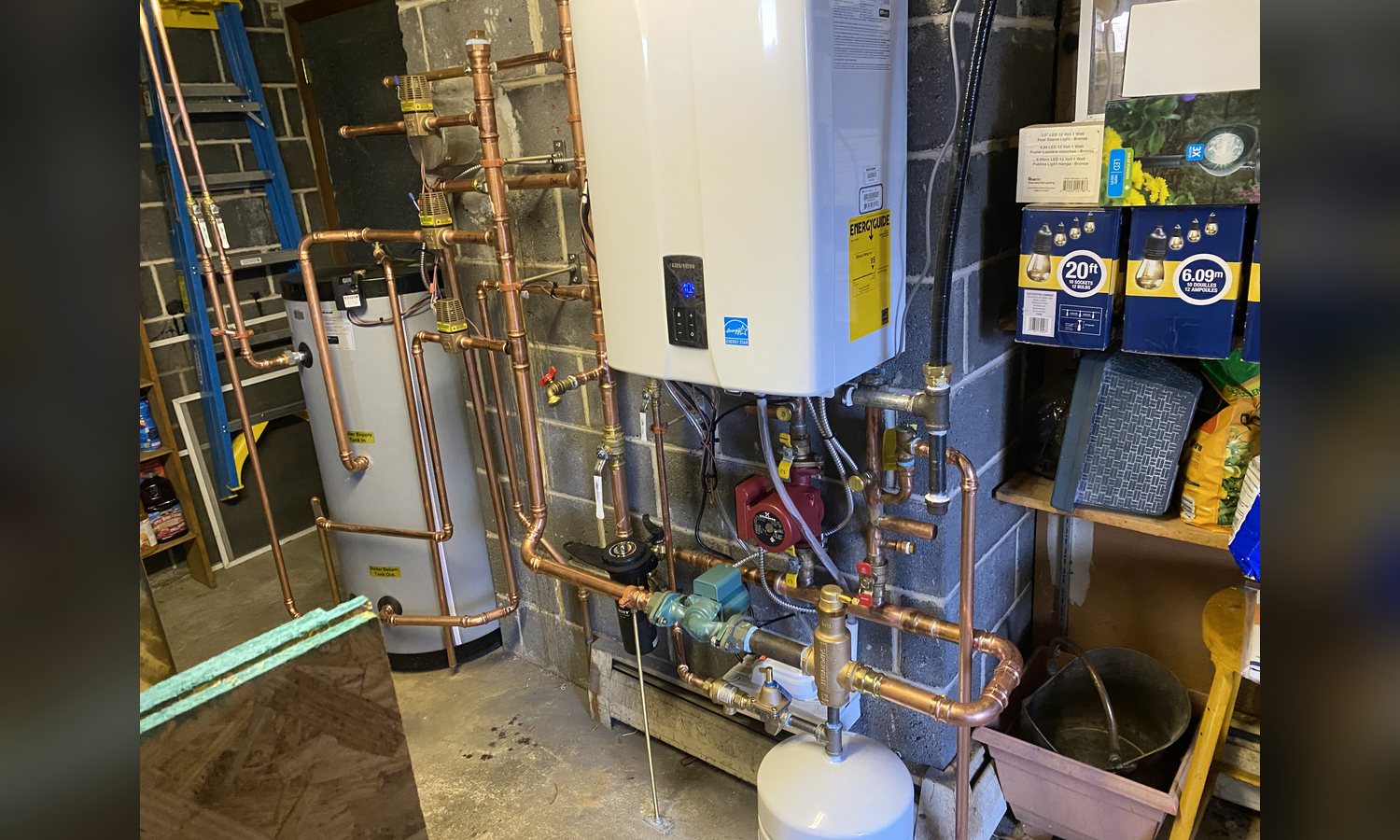 Gas combi boiler and copper manifold installed by Unity Heating & Air Conditioning