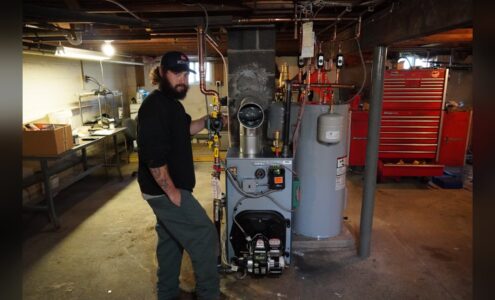 Unity Heating & Air Conditioning technician commissioning a newly installed oil boiler